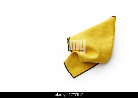 Flat lay with yellow linen kitchen napkin isolated on white background. Folded cloth for mockup with copy space Stock Photo