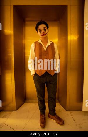 Boy dressed as Joker Stock Photo