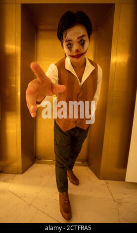 Boy dressed as Joker Stock Photo