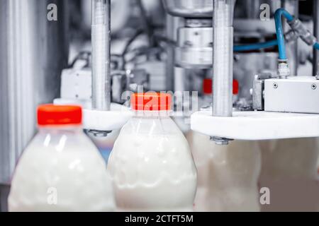 Machine for bottling milk, industry equipment dairy plant Stock Photo