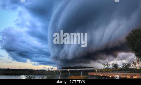 View of the clouds gathering in the sky before rainstorm in Yichun city, northeast China's Heilongjiang province, 11 August 2020. Stock Photo
