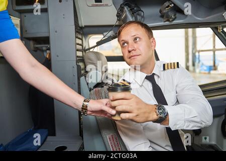 Time to have some coffee before the long international flight Stock Photo