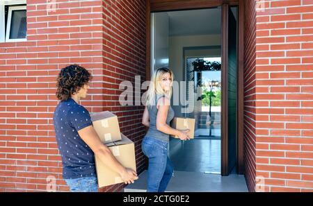 Couple moving into their new home Stock Photo