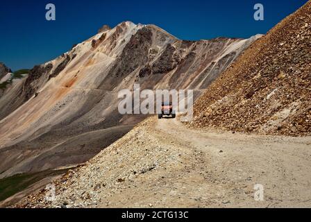 Modified Jeep on Alpine Loop, crossing scree deposits near Engineer Pass, San Juan Mountains, Colorado, USA Stock Photo