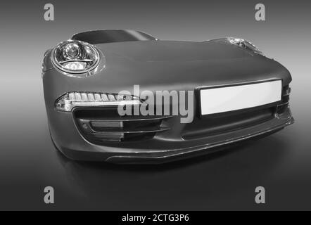 Beautiful sport car monochrome isolated on dark Stock Photo