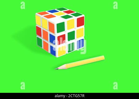 Rubik's cube isolated on green background Stock Photo