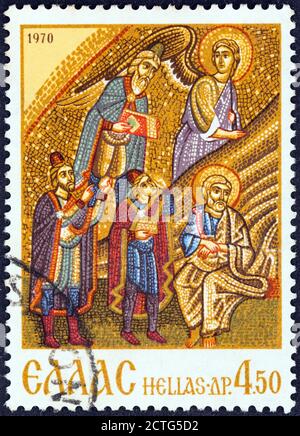 GREECE - CIRCA 1970: A stamp printed in Greece shows the three magi, scene from the Mosaic of the Nativity, Hosios Loukas Monastery. Stock Photo