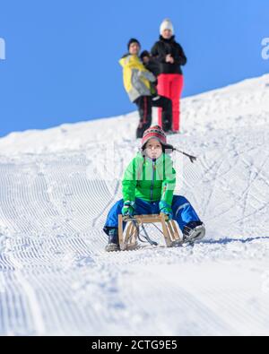 Funny afternoon in wintertime on sleigh Stock Photo