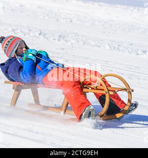 Funny afternoon in wintertime on sleigh Stock Photo