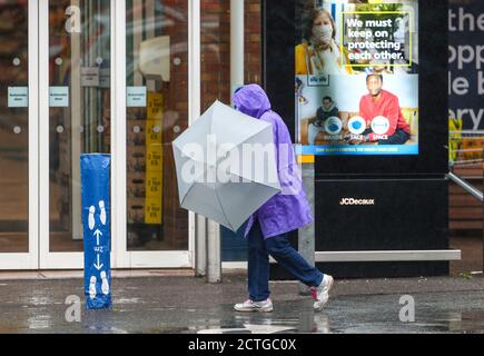 New Forest, Hampshire. 23rd September 2020. UK Weather. Shoppers at Tesco in the New Forest are caught out by heavy rain showers. Credit Stuart Martin/Alamy Live News Stock Photo