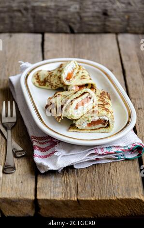 Supper Pancakes with zucchini, salmon and cream cheese. Stock Photo