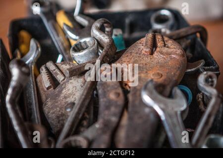 Locking pliers and wrench in tool box texture background Stock Photo