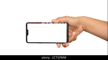 The hand is holding the white screen, the mobile phone is isolated on a white background. Stock Photo