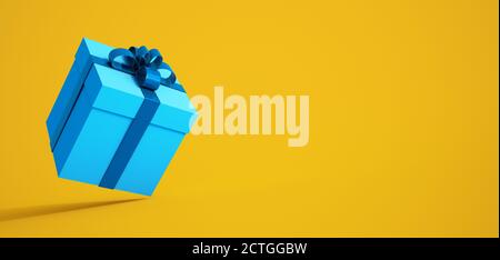 3D rendering of a gift box in yellow and turquoise Stock Photo