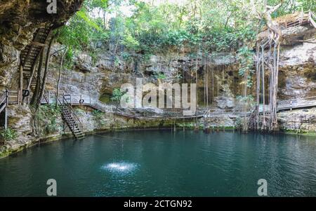 VALLADOLID, MEXICO, MEXICO - May 31, 2019: Cenote X'Canche is a popular cenote for swimming owing to its proximity to the Ek Balam Archaeological Site Stock Photo