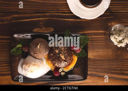 Nicely served chocolate fondant with ice cream. Food styling Stock Photo