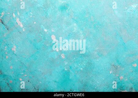 Concrete emerald green background with scuffs and black splashes. Textured wall texture in the grunge style. Stock Photo