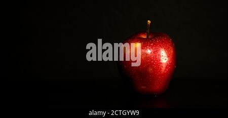 red apple with black backdrop Stock Photo