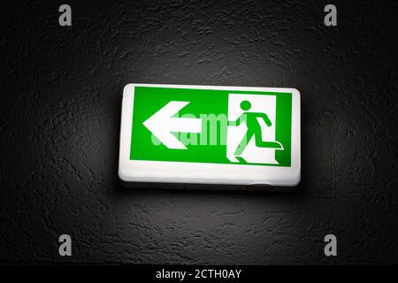 Emergency Exit sign in the dark Stock Photo