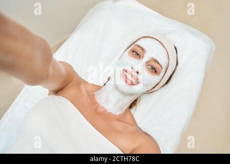 Portrait of moisturizing mask on white background for medical design. Woman Stock Photo