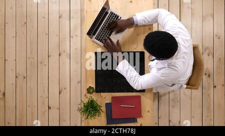 Afro american intellectual man healthcare personnel with white l Stock Photo