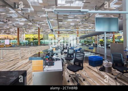 Manual check-in counters at Changi Airport Terminal 3 is deserted, is a  sad scene for the aviation industry during Covid 19 climax. Singapore. Stock Photo