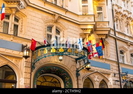 The facade of the old diplomatic building is decorated with flags of different countries. Stock Photo