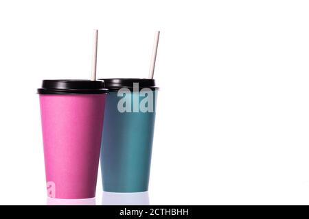 blue and pink disposable paper coffee cups with plastic caps and straws Stock Photo