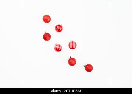 Christmas concept with red balls decoration on white background. Flat lay, top view Stock Photo
