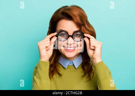 Close-up portrait of nice attractive content cheerful cheery wavy-haired girl scientist touching thick glasses learning subject isolated on bright Stock Photo