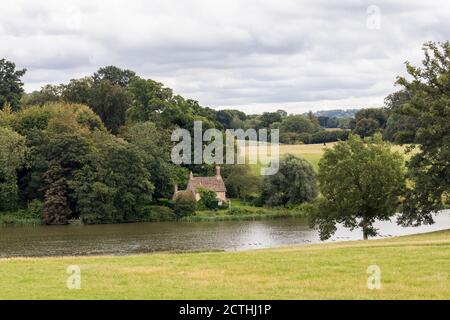Lakeside cottage near the lake and in the parkland of Bowood House & Gardens, Wiltshire, England, UK Stock Photo