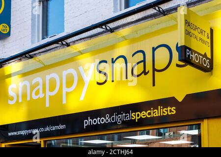 Sign above a branch of Snappy Snaps in Camden High Street, London, UK Stock Photo