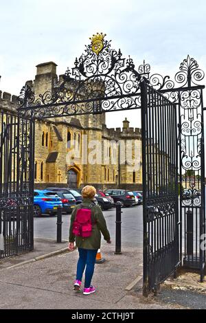 Cecily Hill Barracks(1857) was an armoury & is known as The Castle. Viewed through the ornate decorative gates to Cirencester Park. Stock Photo