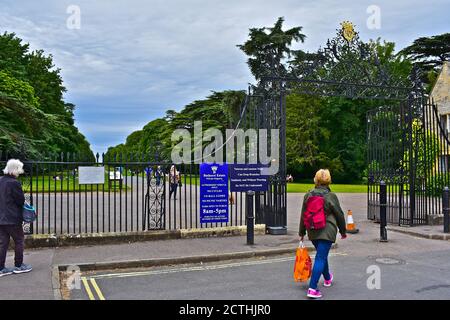 A view of the ornate entrance gates to Cirencester Park, an extensive estate owned by the Bathurst Family. Open to the public. Stock Photo