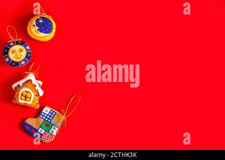 Christmas background with embroidered Christmas toys on red background, holiday, new year and Christmas concept. Stock Photo