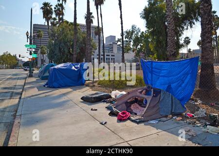 Los Angeles, CA, USA - August 22, 2020: Unidentified homeless people live in tents on street in the city of LA, social shortcomings Stock Photo
