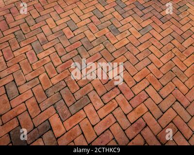 Panorama of rich orange brick in a herringbone pattern, perspective view, horizontal aspect Stock Photo