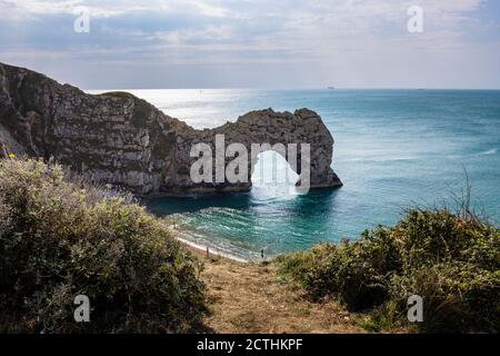 Panoramic coastal clifftop view of picturesque Durdle Door rock formation on the Jurassic Coast World Heritage site in Dorset, south-west England