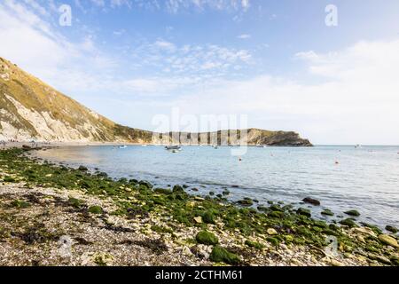 Picturesque coastal view of the bay and chalk cliffs at Lulworth Cove on the Jurassic Coast World Heritage site in Dorset, south-west England Stock Photo