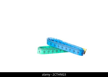 Two stacked blue and green measuring tapes isolated on white background Stock Photo