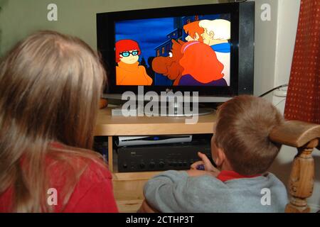 siblings watching scooby doo Stock Photo