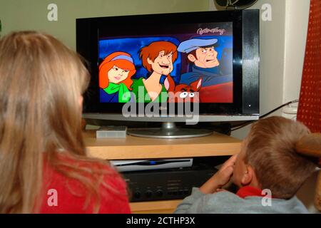 siblings watching scooby doo Stock Photo