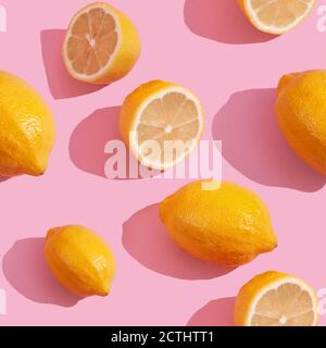 Trendy isometric Seamless continuous pattern of yellow lemons on pink background. Minimalist concept of fresh citrus fruit Stock Photo