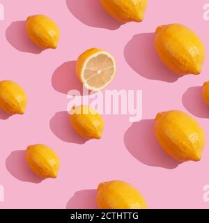 Trendy isometric Seamless continuous pattern of yellow lemons on pink background. Minimalist concept of fresh citrus fruit Stock Photo