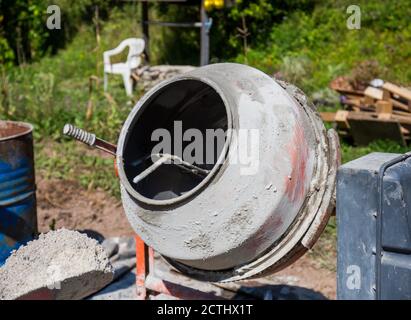 concrete mixer, construction work in progress. Mixer positioned and ready to use Stock Photo