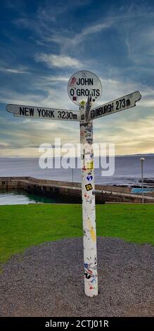 The milepost sign at John O' Groats in Scotland on the most north eastern tip of the UK