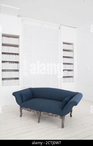 Sofa By Wall At Home, Scandinavian Interior Of Living Room Concept, Light Gray Sofa With Gold Lamp On White Flooring Stock Photo