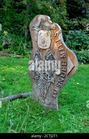 Carved wooden sign for Snuff Mills park which runs alongside the river Frome in Bristol, UK Stock Photo