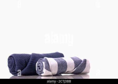 Blue waffle towel, striped white and blue towel rolled up. two linen towels Stock Photo