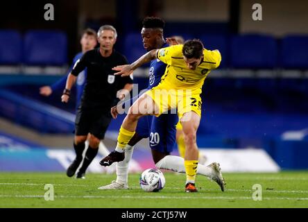 Chelsea's Callum Hudson-Odoi (left) and Barnsley's Dominik Frieser battle for the ball during the Carabao Cup third round match at Stamford Bridge, London. Stock Photo